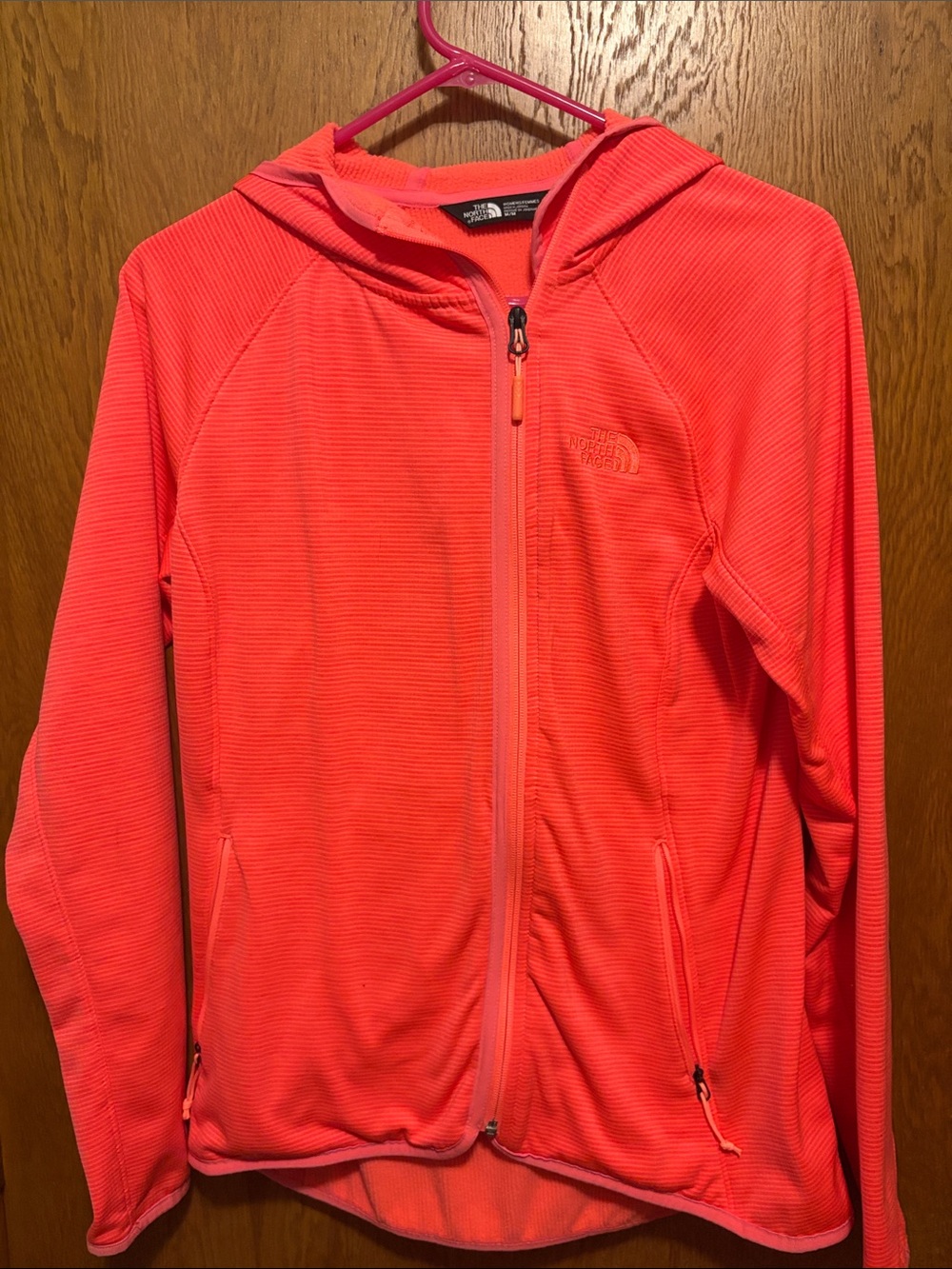 The North Face women’s size medium, coral colored Hooded Zip-Up Jacket